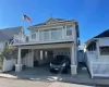 View of front of property with a carport