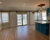 Kitchen featuring a barn door, decorative light fixtures, and plenty of natural light