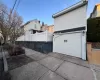 View of side of property with a garage