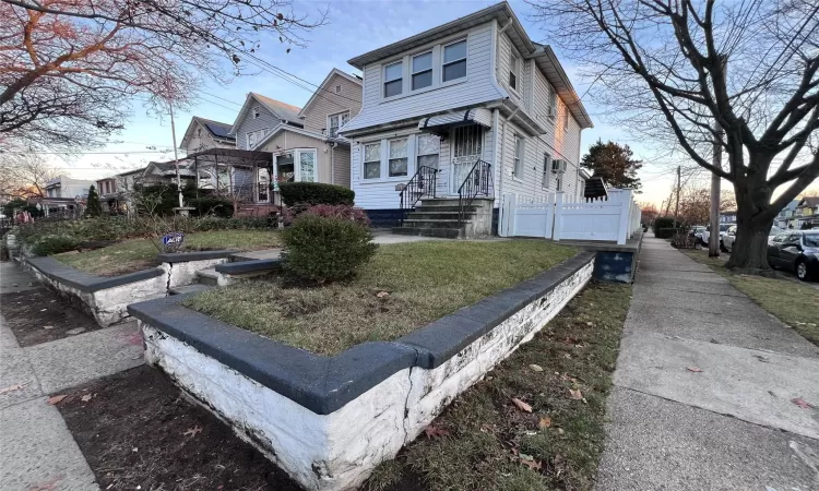 View of front of house with a lawn