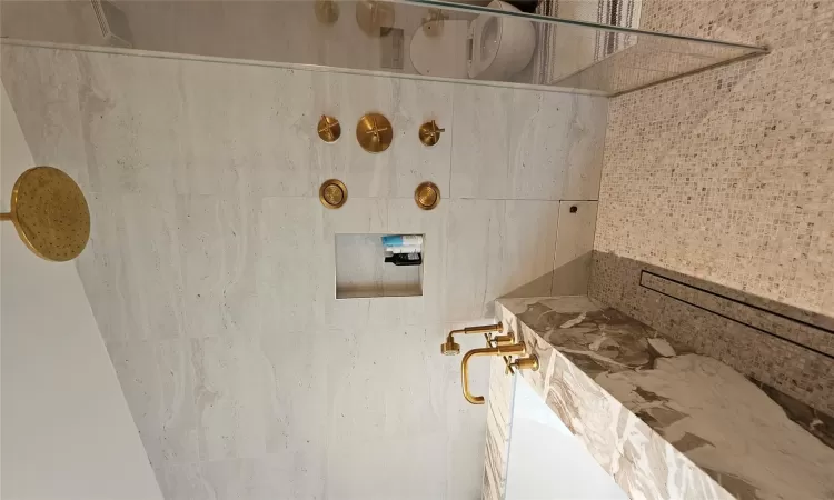 Bathroom featuring tile walls, independent shower and bath, and tile patterned flooring