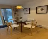 Dining space featuring light wood-type flooring and a baseboard heating unit