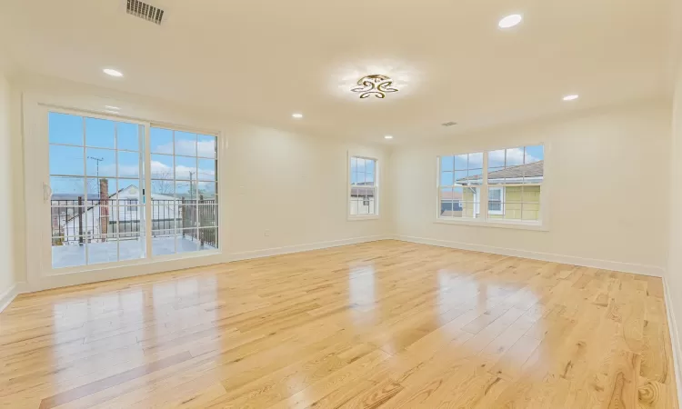 Unfurnished room featuring light hardwood / wood-style floors and ornamental molding