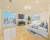 Bedroom featuring crown molding and light hardwood / wood-style flooring