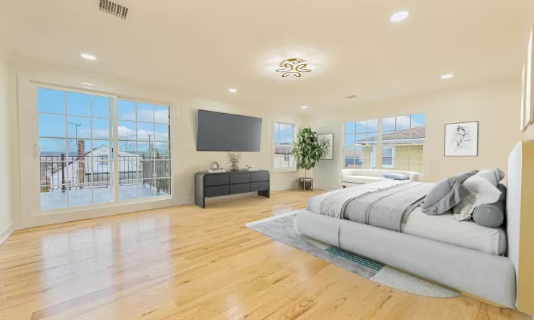 Bedroom featuring crown molding and light hardwood / wood-style flooring