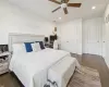 Bedroom featuring ceiling fan, dark wood-type flooring, and a closet