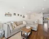 Living room with wood-type flooring