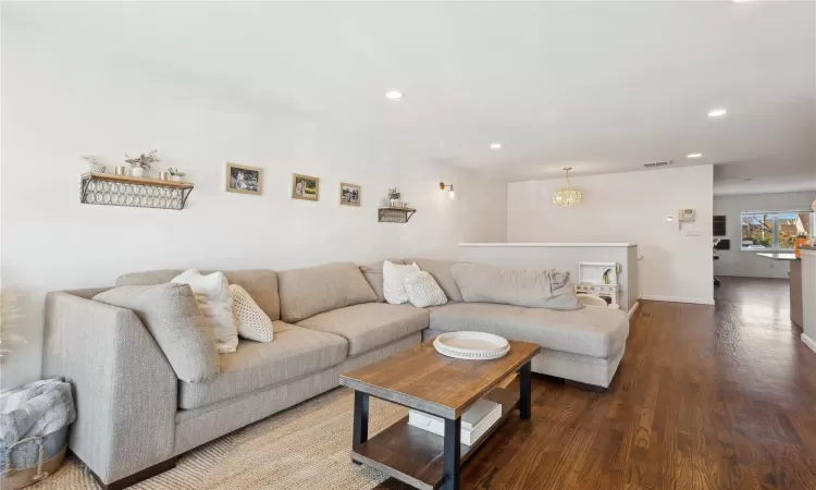 Living room with wood-type flooring