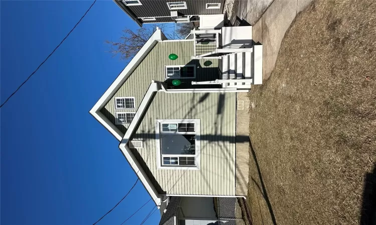 Additional living space featuring dark hardwood / wood-style floors, lofted ceiling, and a baseboard heating unit