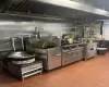 Kitchen featuring tile patterned floors and high end range