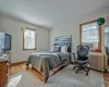 Living room with beam ceiling, plenty of natural light, hardwood / wood-style floors, and coffered ceiling