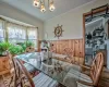 Kitchen with white dishwasher, ceiling fan, radiator heating unit, and sink