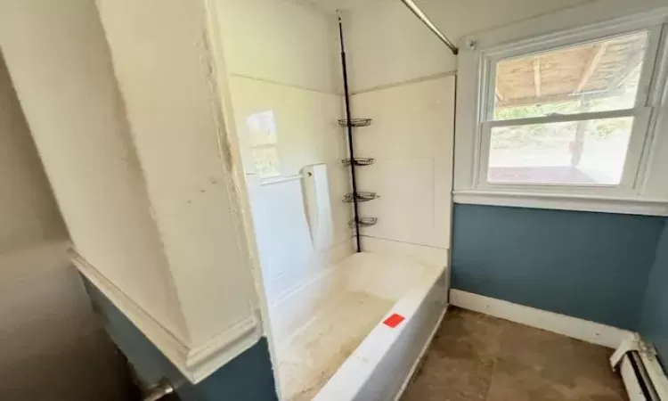 Bathroom featuring a baseboard heating unit