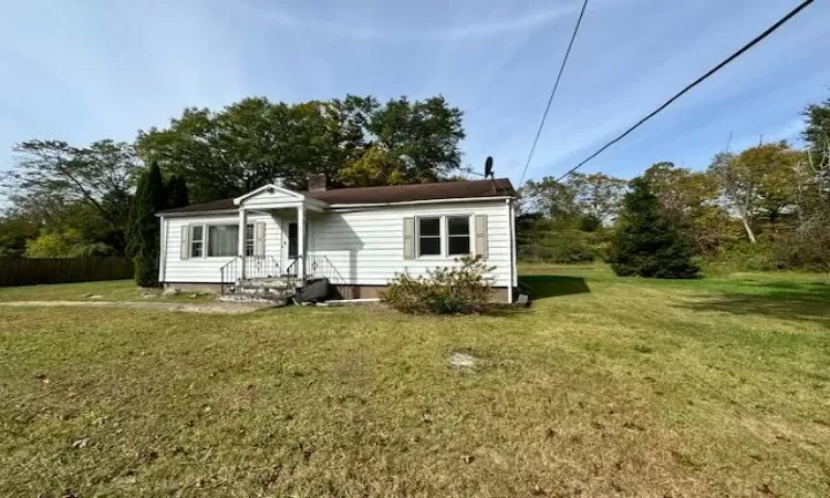 View of front of property with a front yard