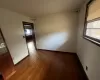 Unfurnished room with hardwood / wood-style flooring