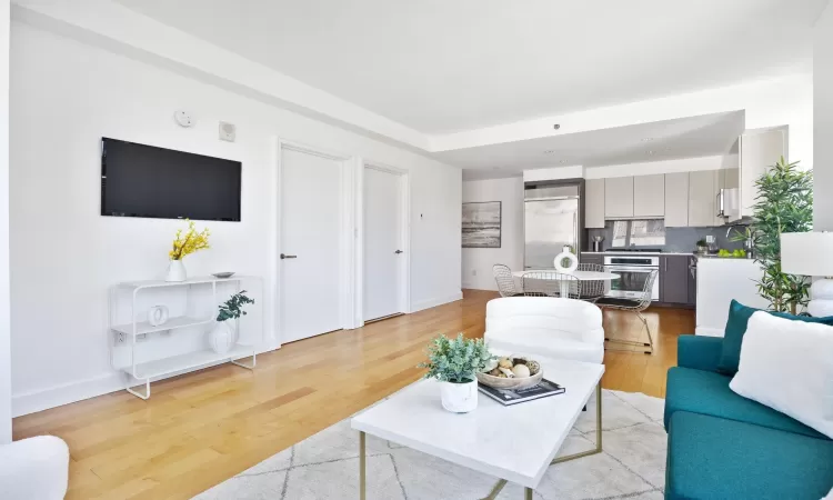 Living room with light wood-type flooring