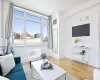 Living room with hardwood / wood-style floors