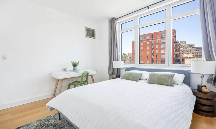 Bedroom with hardwood / wood-style floors