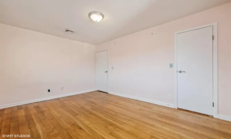 Spare room featuring light wood-type flooring