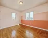 Unfurnished room with hardwood / wood-style floors