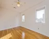 Spare room featuring ceiling fan and hardwood / wood-style flooring