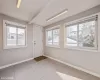 Foyer entrance with beam ceiling and light tile patterned floors