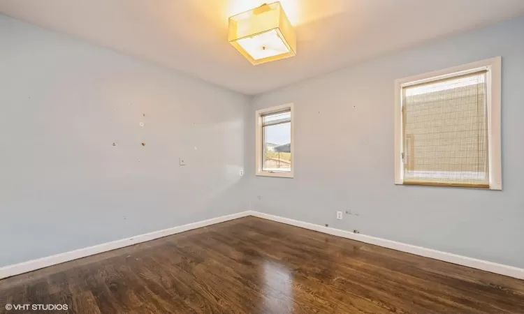 Unfurnished room featuring hardwood / wood-style floors