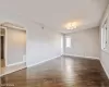 Unfurnished room with dark hardwood / wood-style flooring