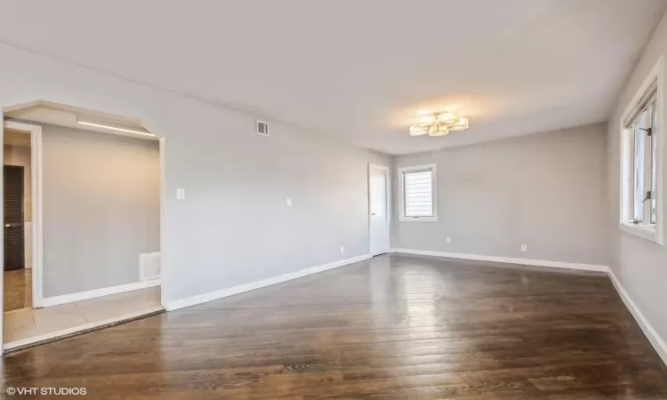 Unfurnished room with dark hardwood / wood-style flooring