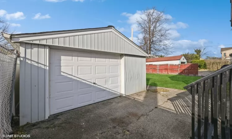 Garage featuring a yard