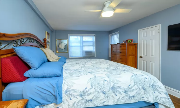 Bedroom featuring hardwood / wood-style floors and ceiling fan