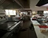 Kitchen with a wealth of natural light and dark tile patterned flooring