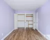 Unfurnished bedroom with hardwood / wood-style flooring