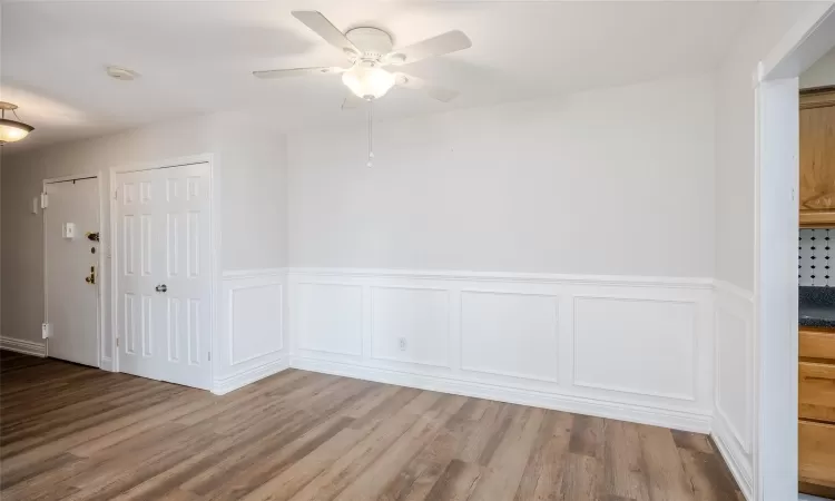 Empty room featuring hardwood / wood-style flooring and ceiling fan