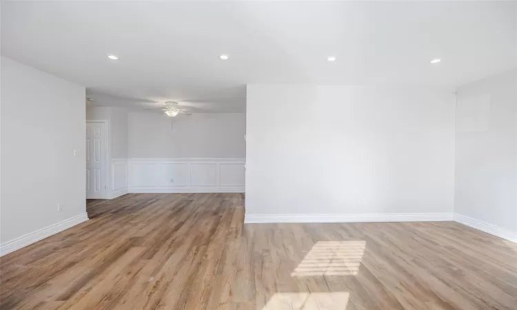 Empty room featuring ceiling fan and light wood-type flooring