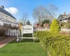 Community sign featuring a yard