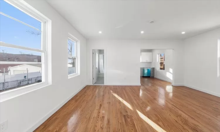 Unfurnished living room with light wood-type flooring