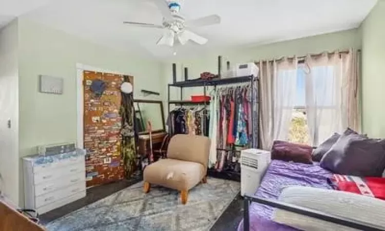 Bedroom with ceiling fan and a closet