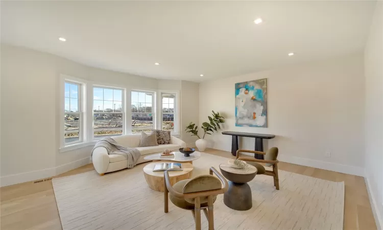 Living room with light wood-type flooring