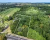 Birds eye view of property featuring a rural view