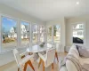 Living area featuring a towering ceiling, a multi sided fireplace, visible vents, and recessed lighting