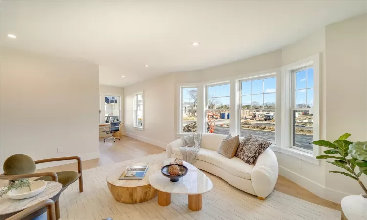 Living room with light hardwood / wood-style flooring