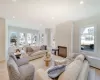 Living room featuring a large fireplace and light wood-type flooring