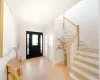 Foyer entrance with light hardwood / wood-style floors