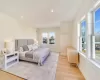 Bedroom with light hardwood / wood-style floors