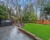 View of yard featuring area for grilling and a patio