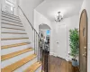 Foyer entrance featuring a chandelier and dark hardwood / wood-style floors