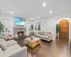 Living room with a stone fireplace