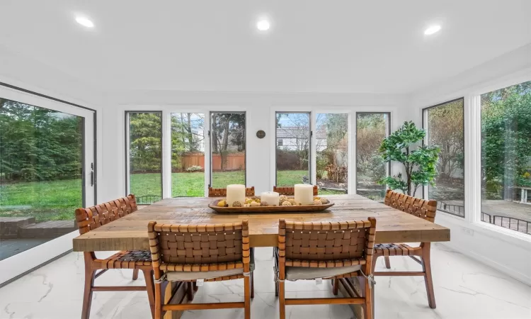 Sunroom featuring a wealth of natural light