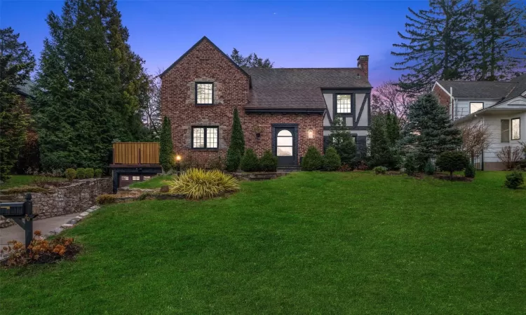 Tudor house with a lawn